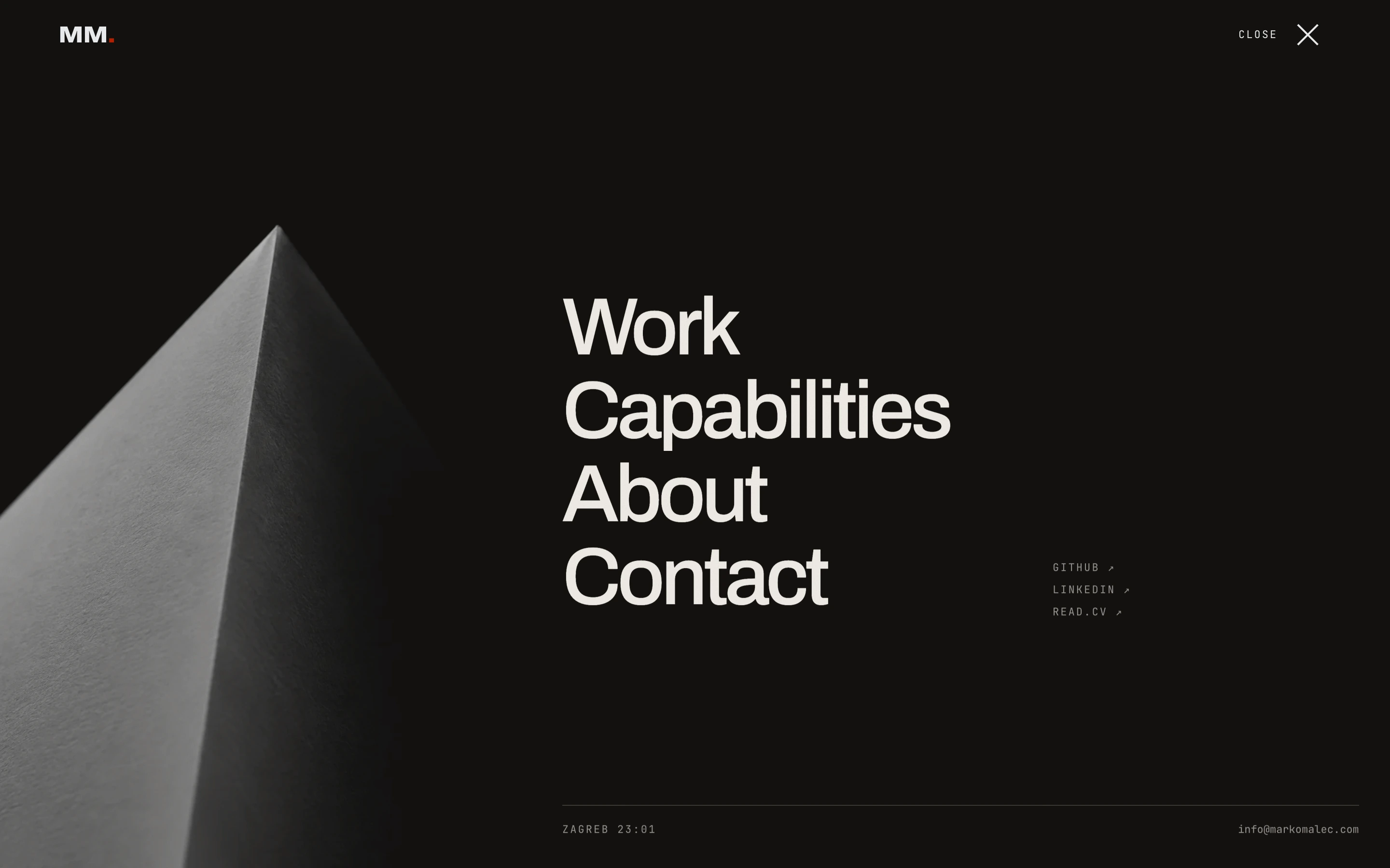 Full-screen portfolio menu with a folded paper texture and large navigation links